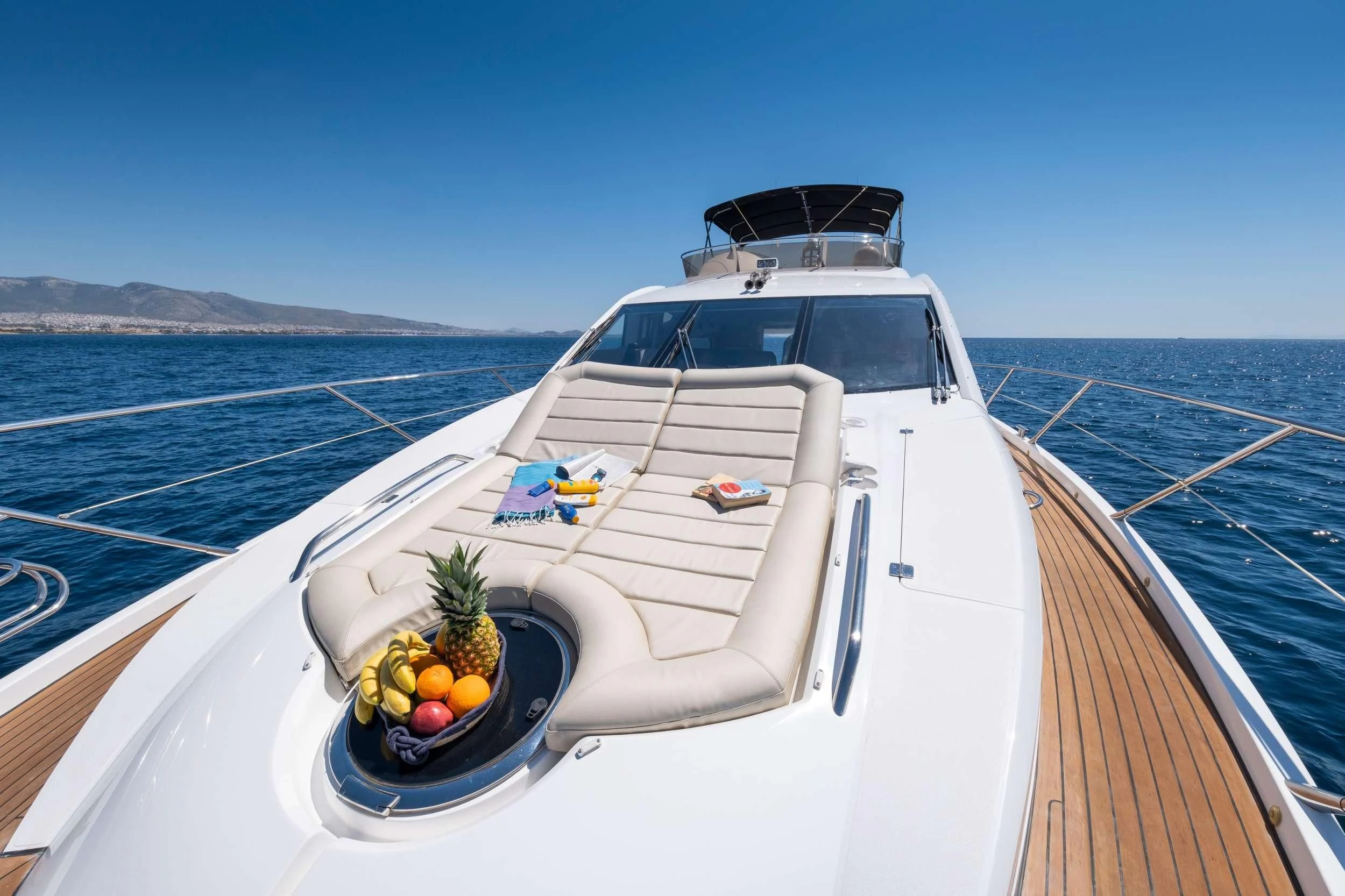 a white boat with fruit on the front aboard POLPO Yacht for Charter