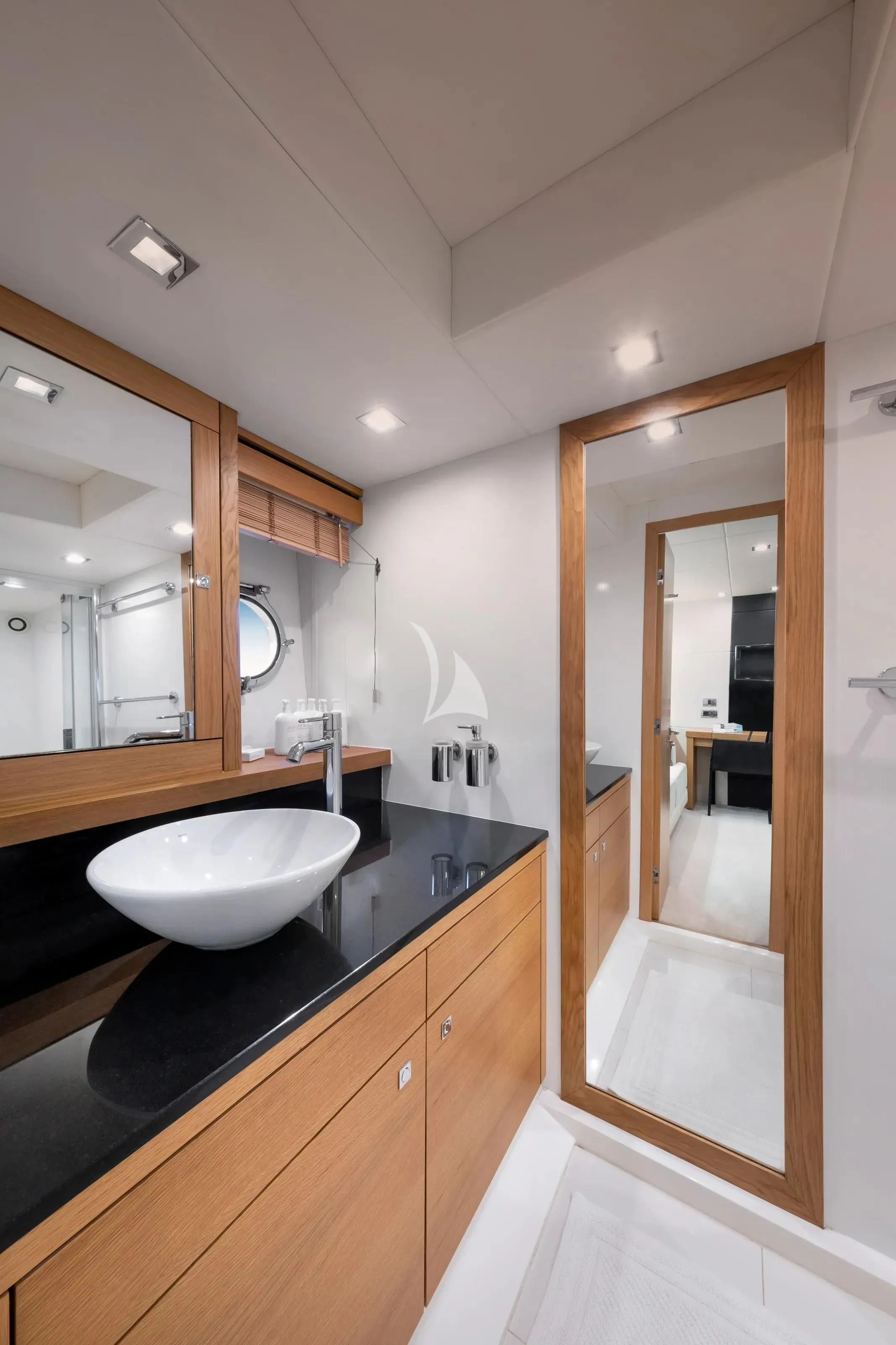 a bathroom with a sink and a mirror aboard POLPO Yacht for Charter