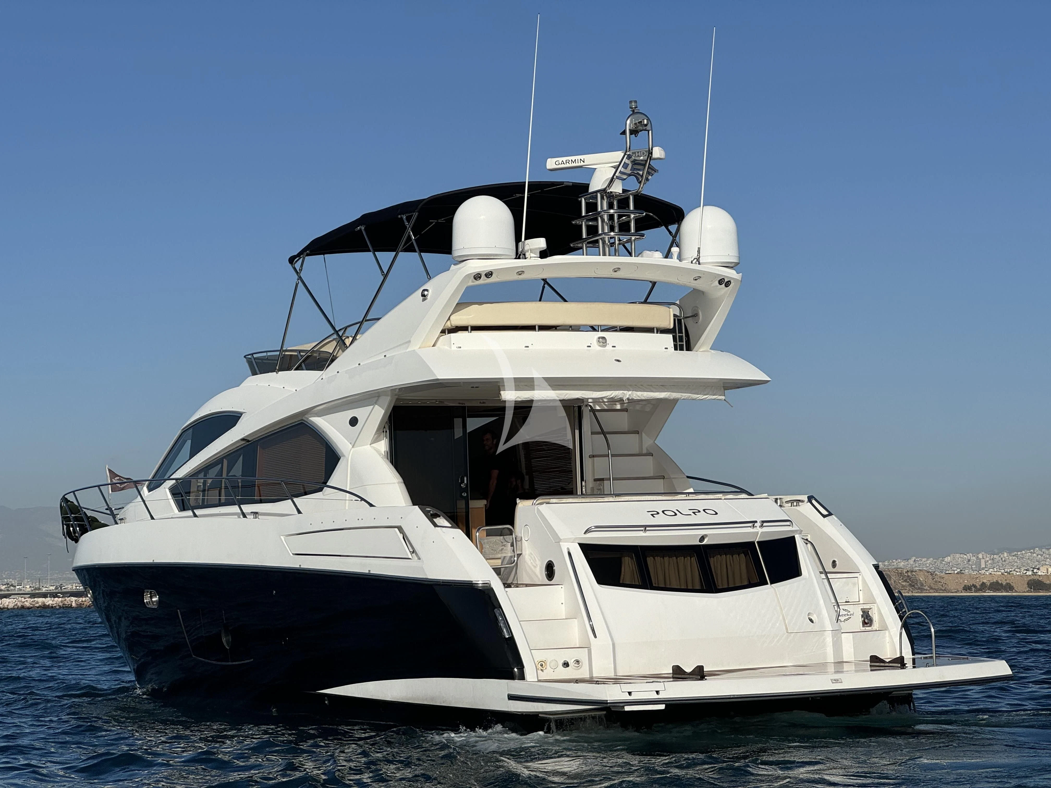 a white yacht on the water aboard POLPO Yacht for Charter