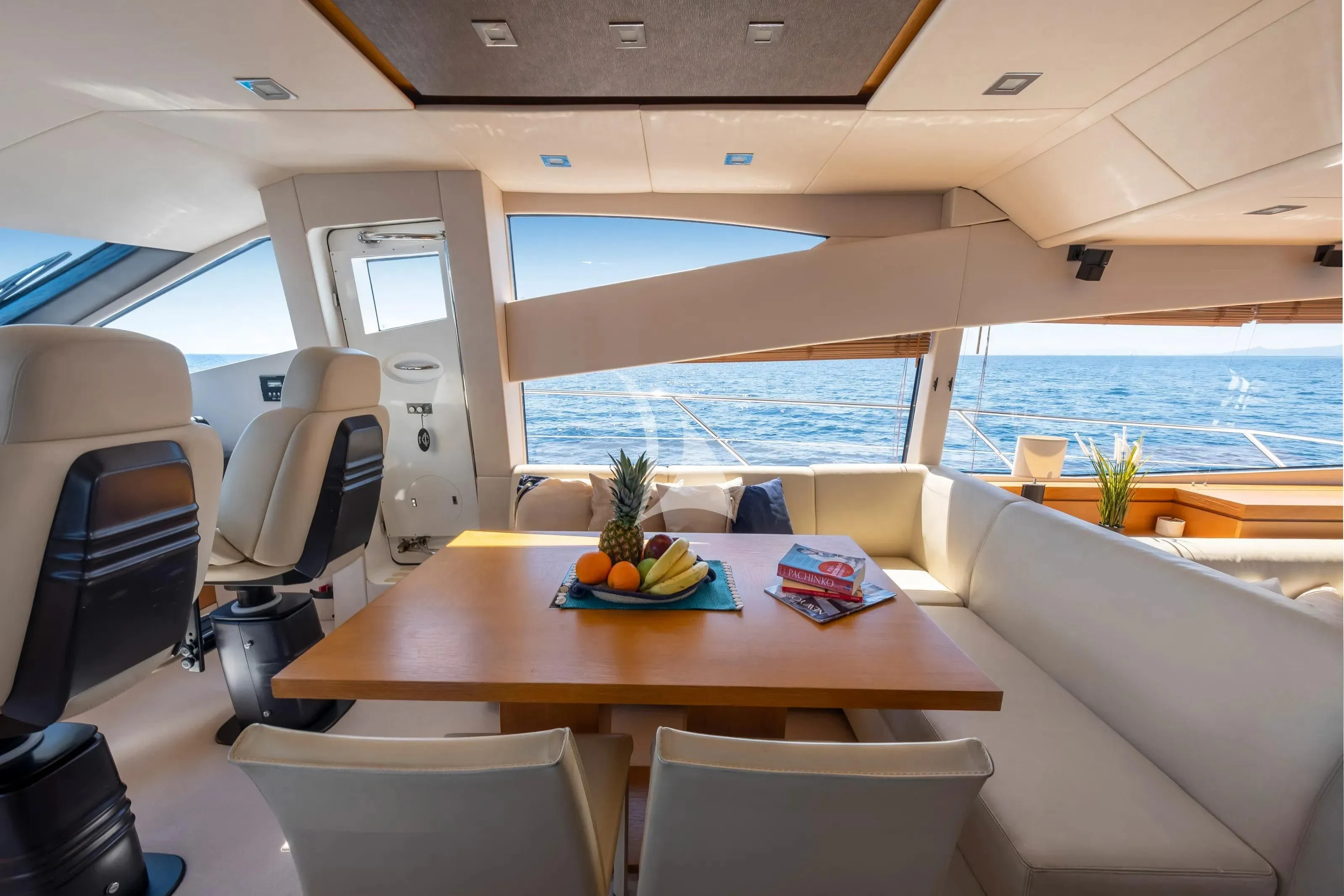 a room with a table and chairs aboard POLPO Yacht for Charter