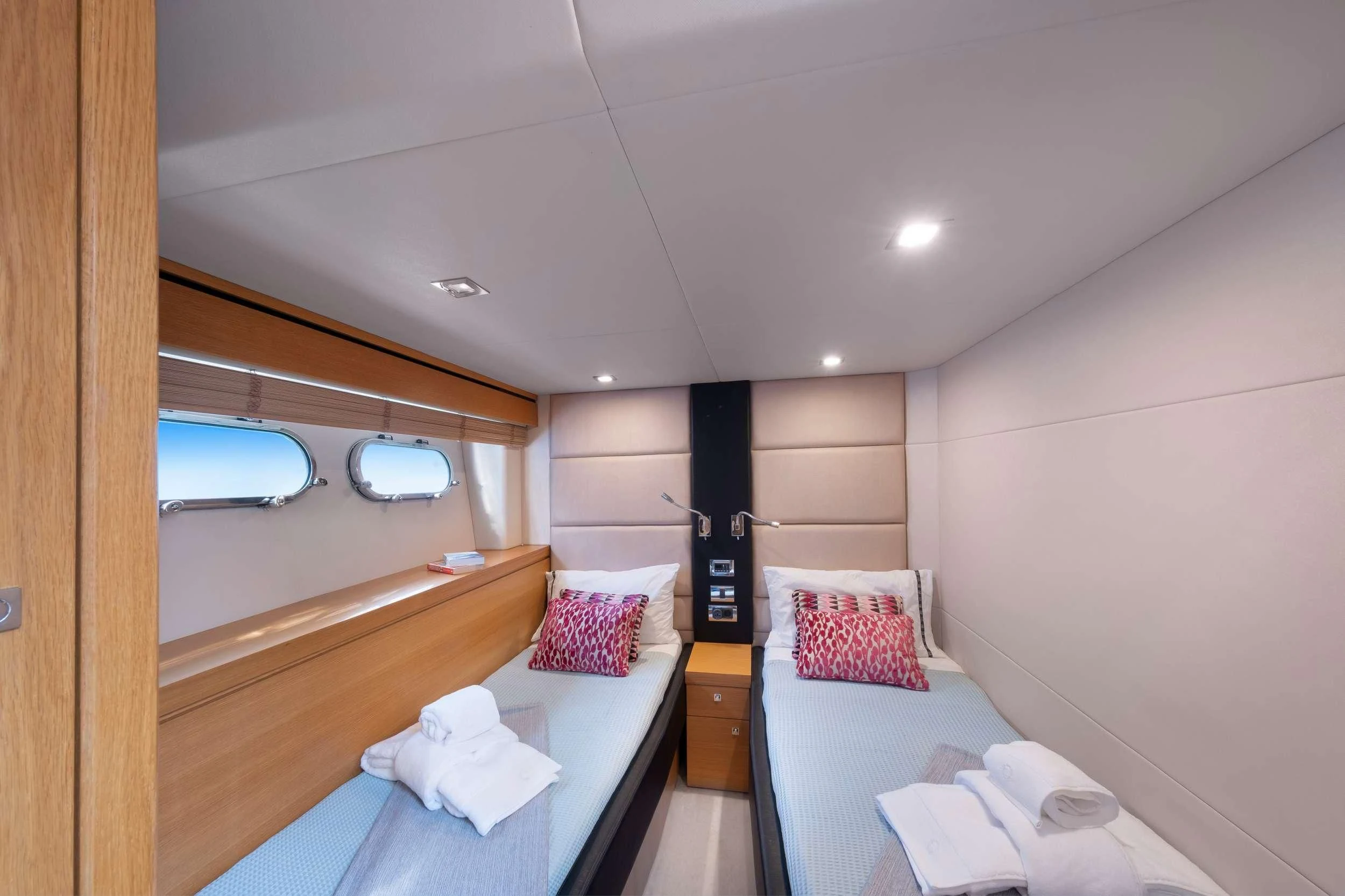 a room with a bed and a window aboard POLPO Yacht for Charter