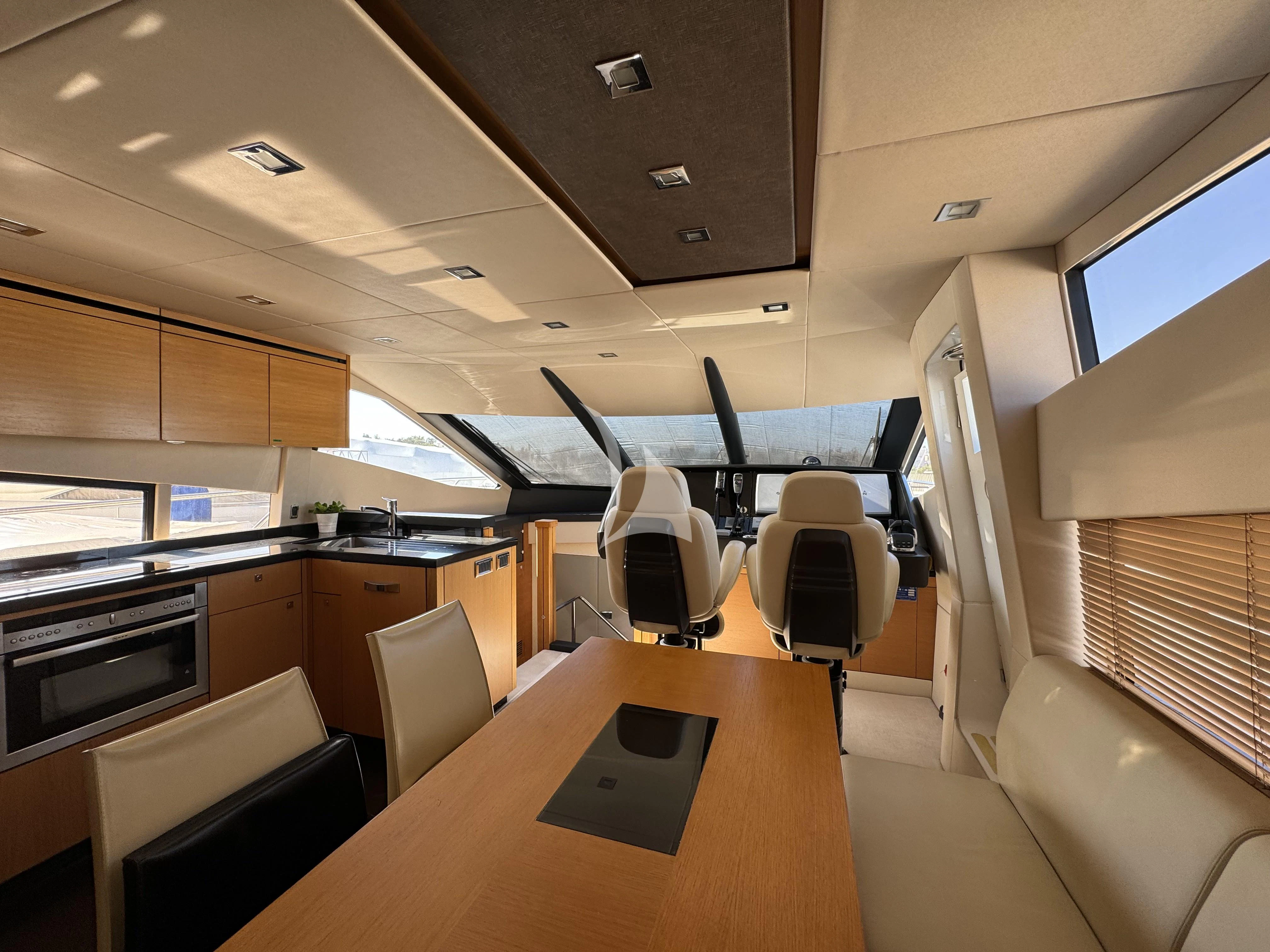 a room with a table and chairs aboard POLPO Yacht for Charter