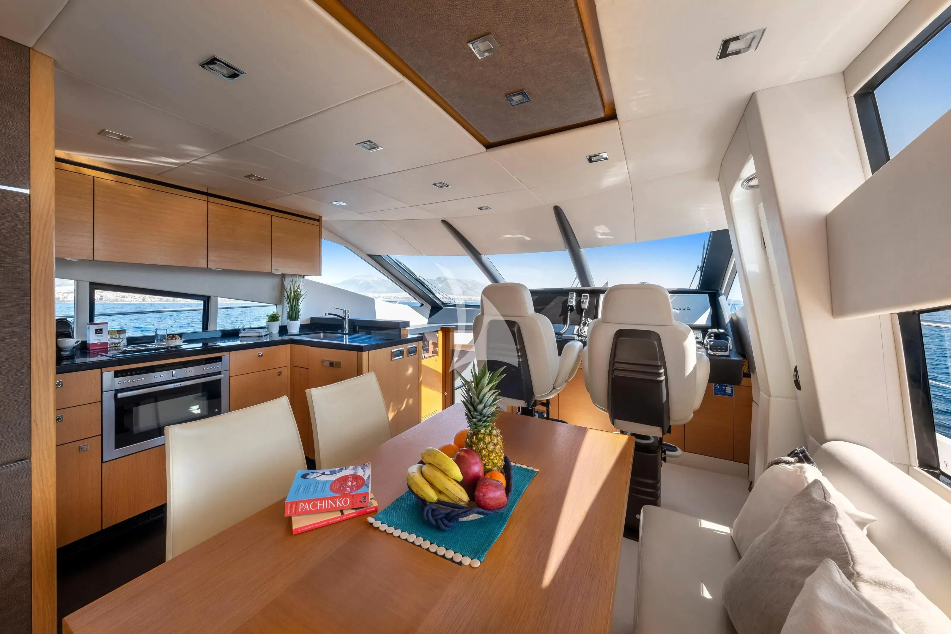 a kitchen with a table and chairs aboard POLPO Yacht for Charter