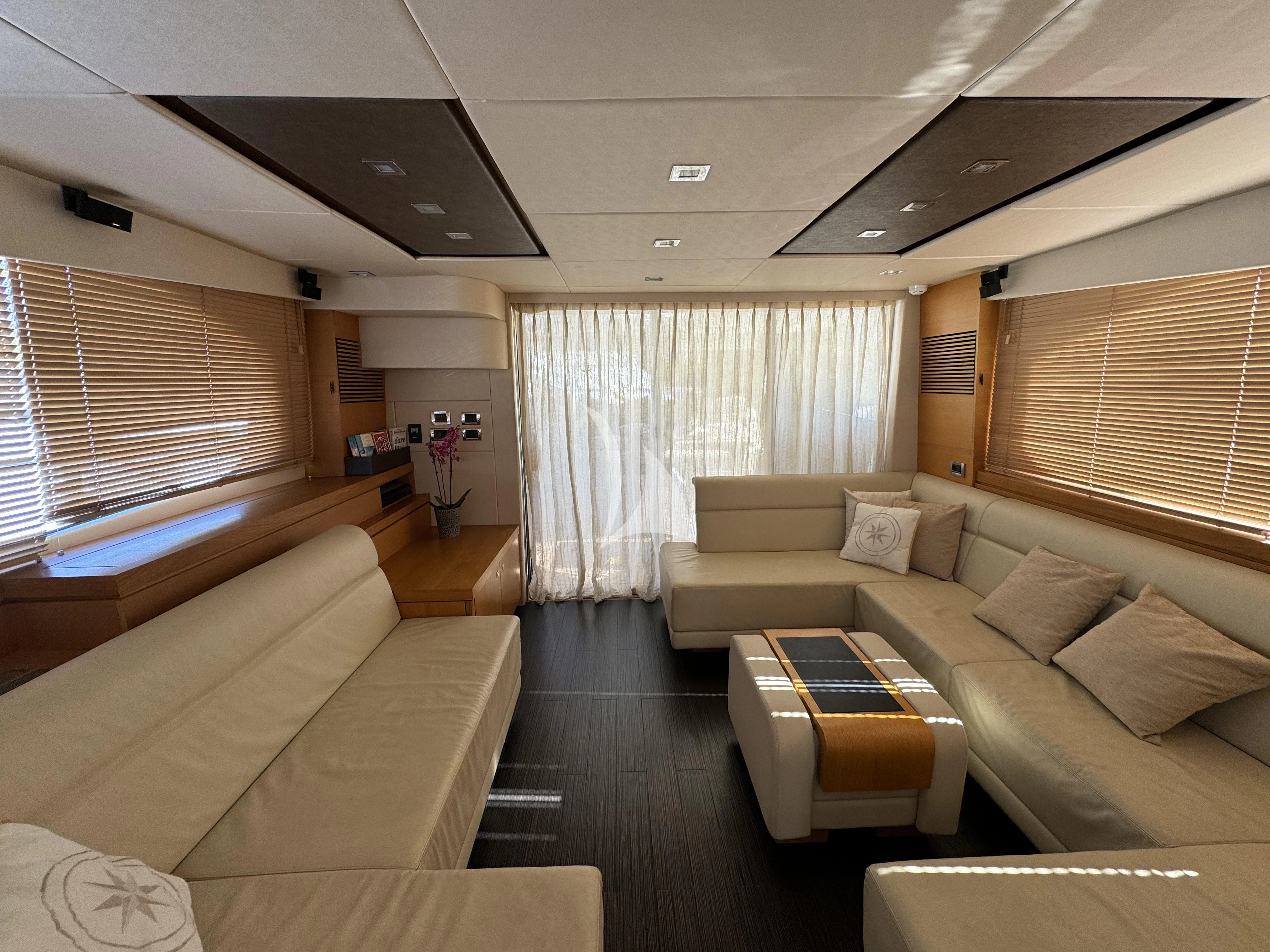 a living room with a couch and a table aboard POLPO Yacht for Charter