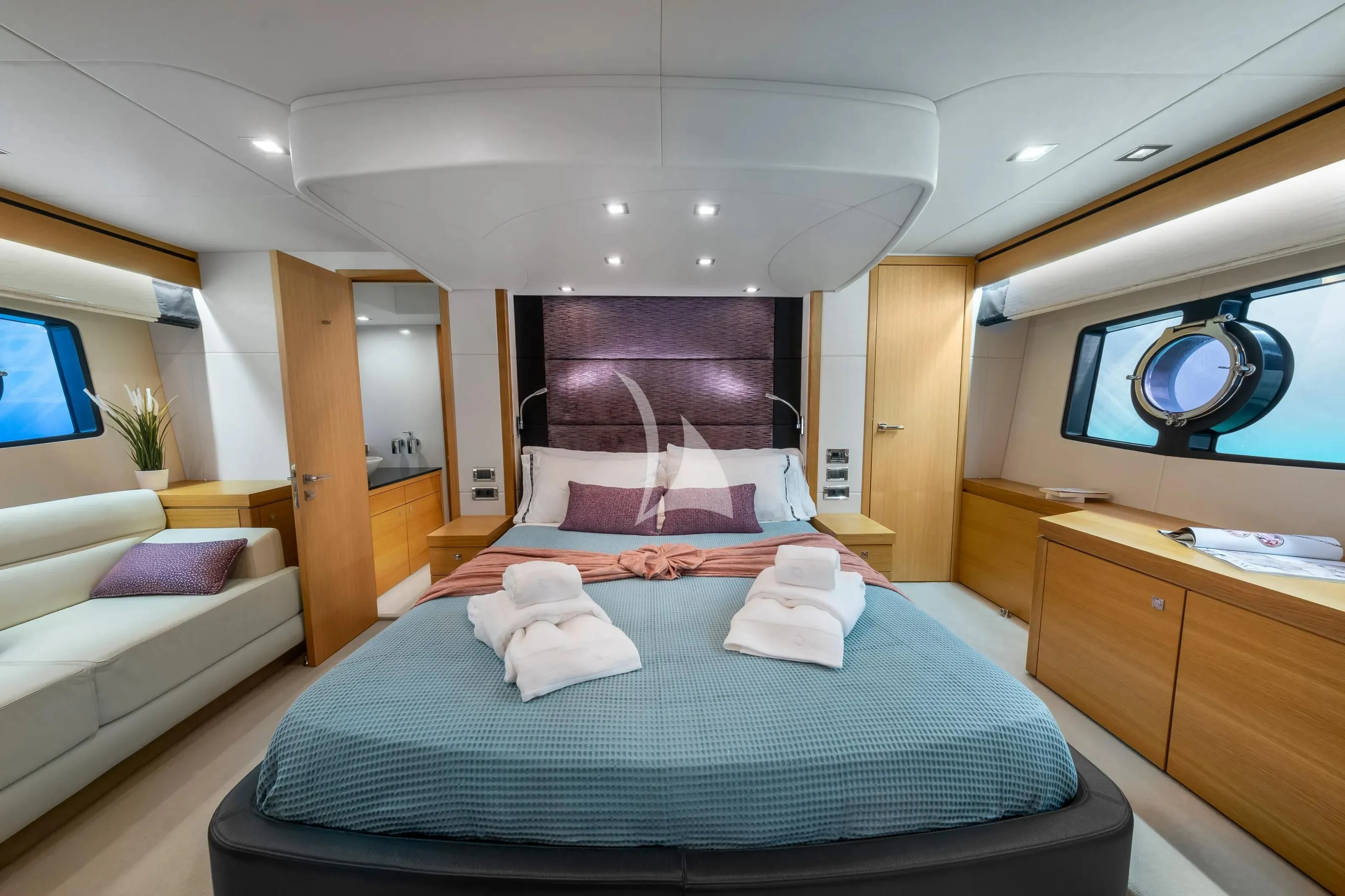 a bedroom with a bed and a tv aboard POLPO Yacht for Charter