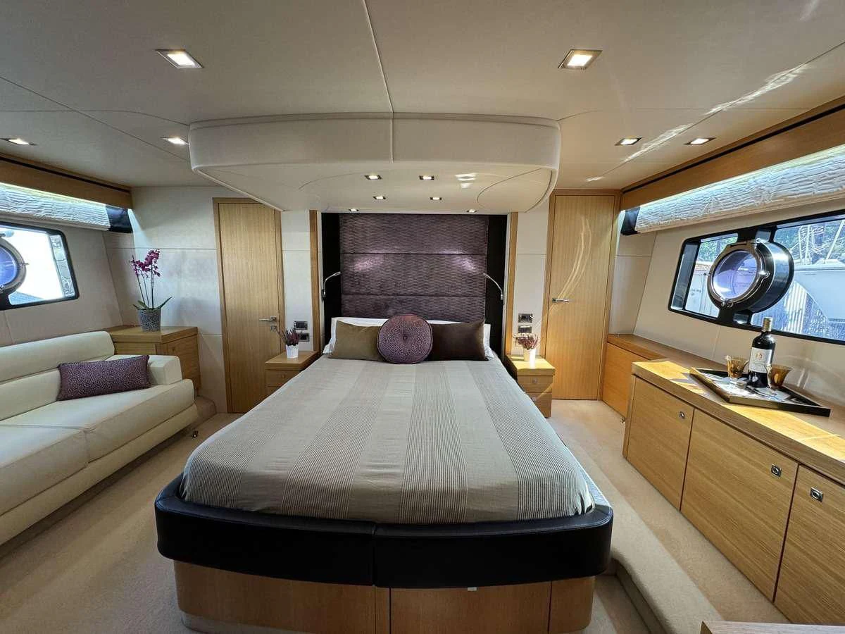 a bedroom with a bed and a desk aboard POLPO Yacht for Charter
