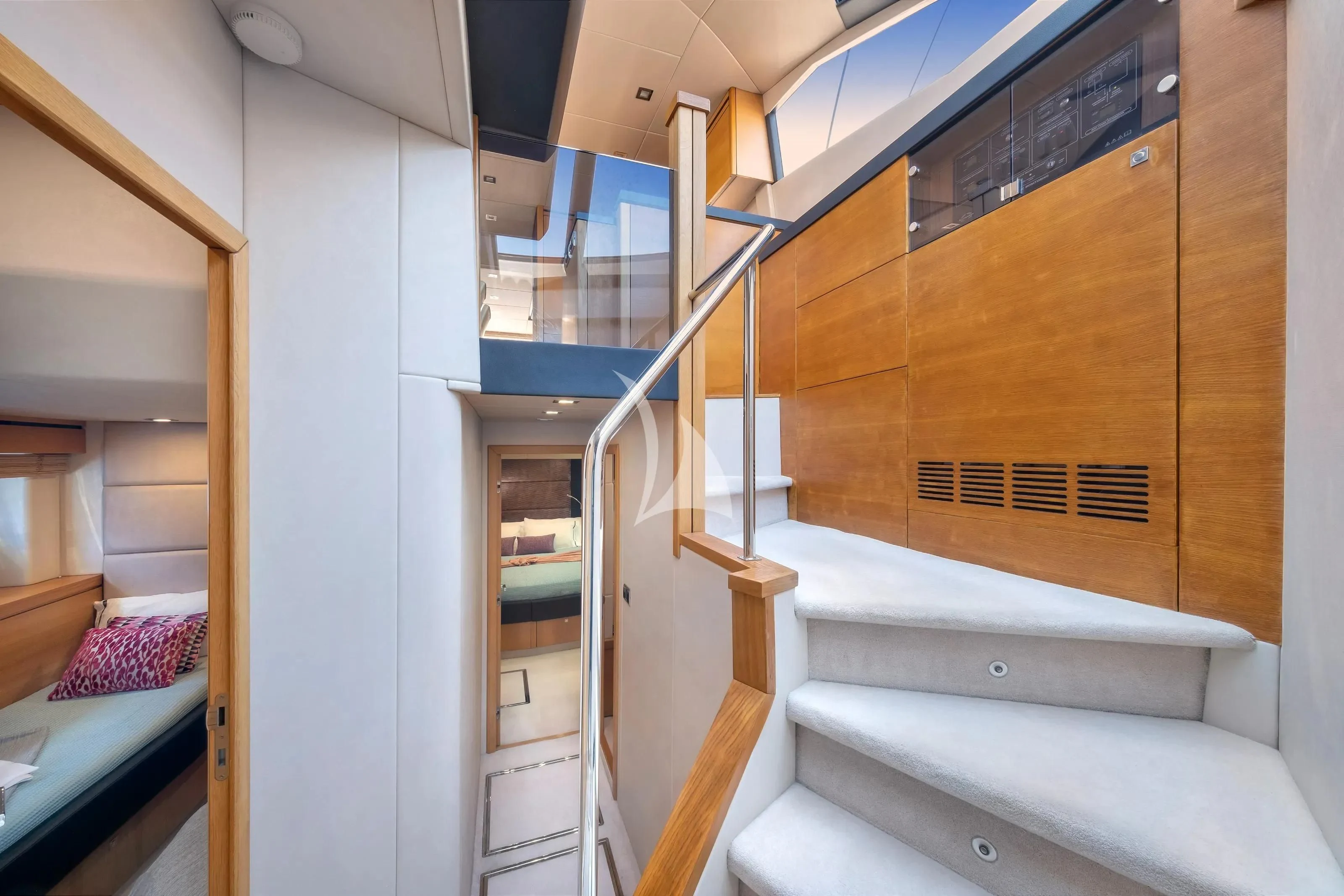 a room with a bed and a staircase aboard POLPO Yacht for Charter