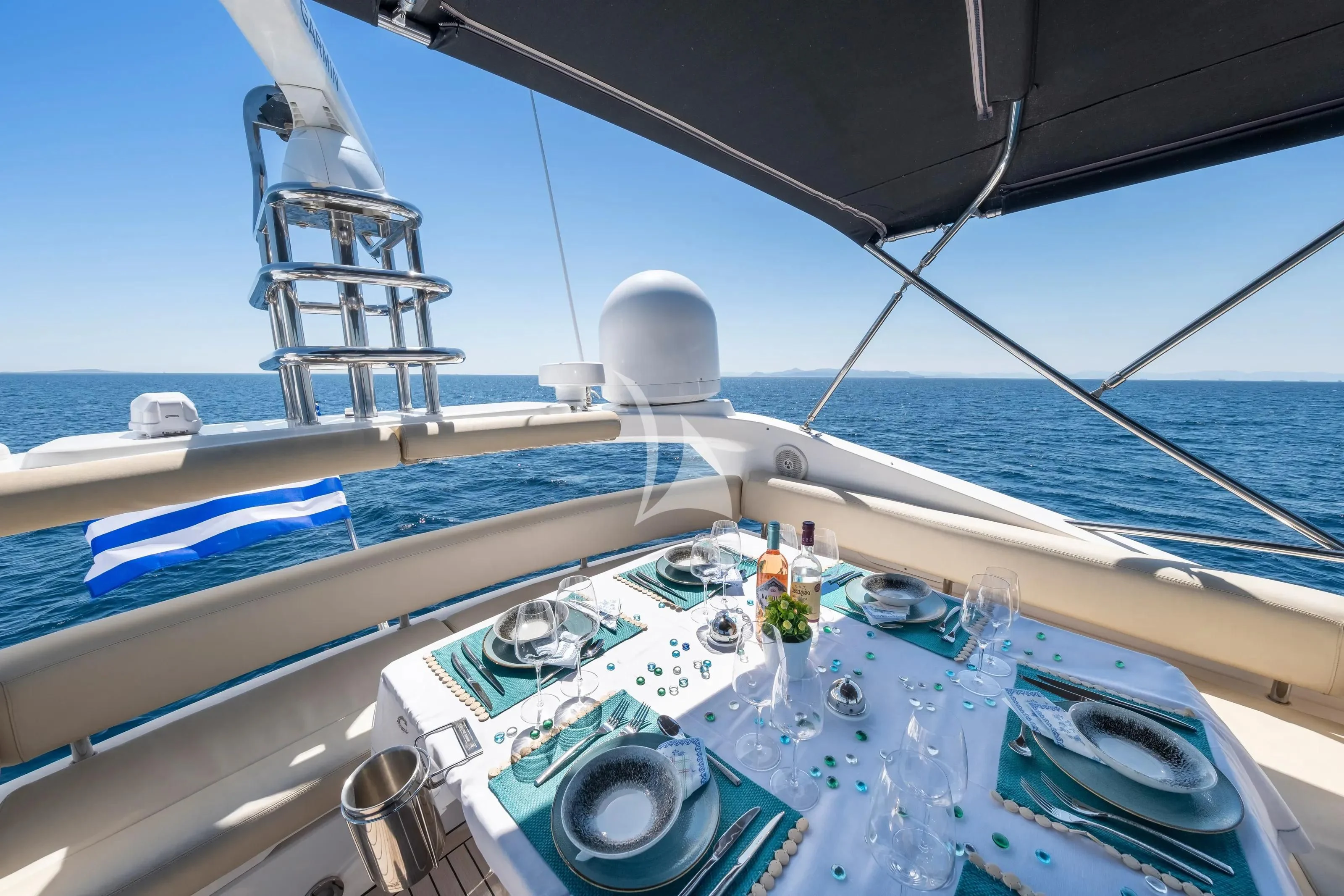 a boat with drinks on the deck aboard POLPO Yacht for Charter