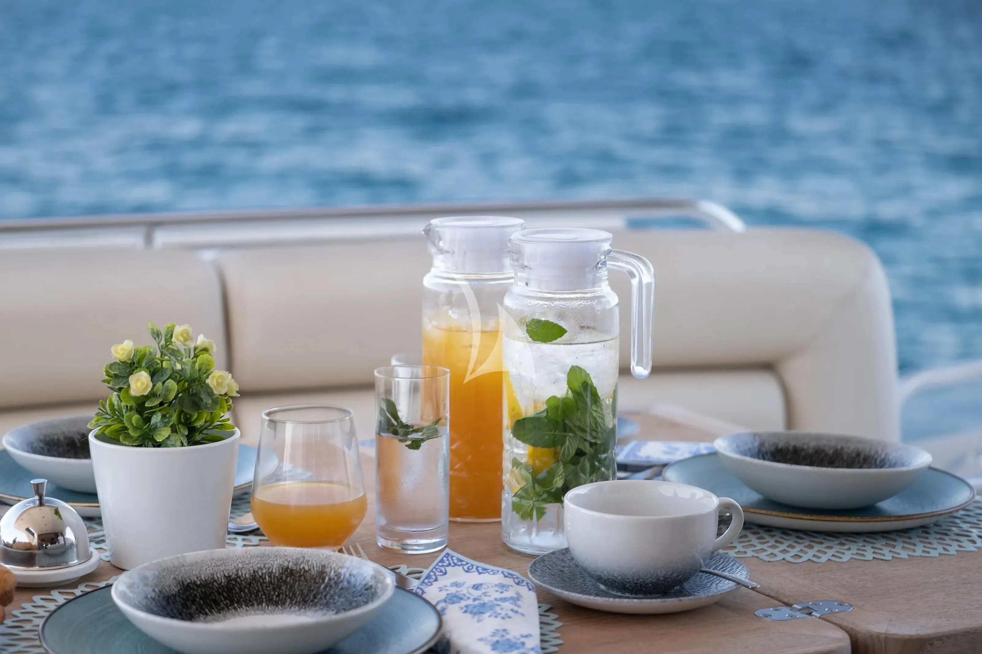 a table with a variety of drinks aboard POLPO Yacht for Charter