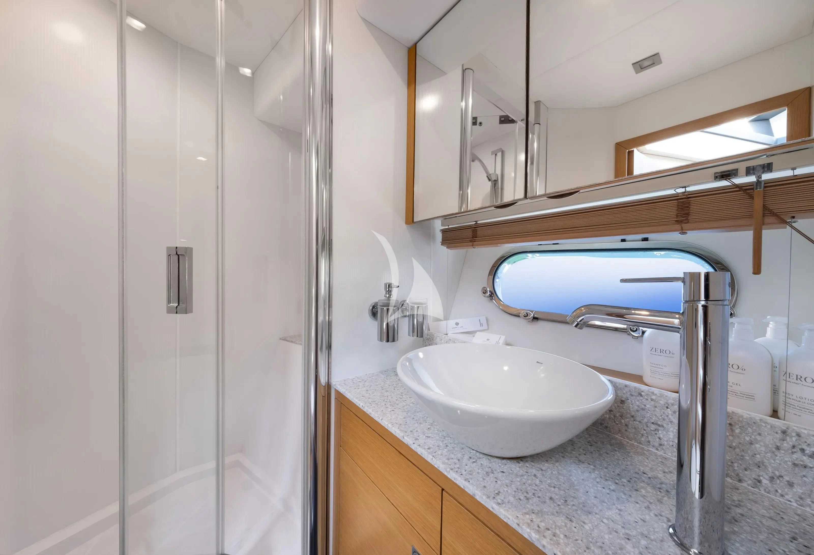 a bathroom with a sink and a mirror aboard POLPO Yacht for Charter