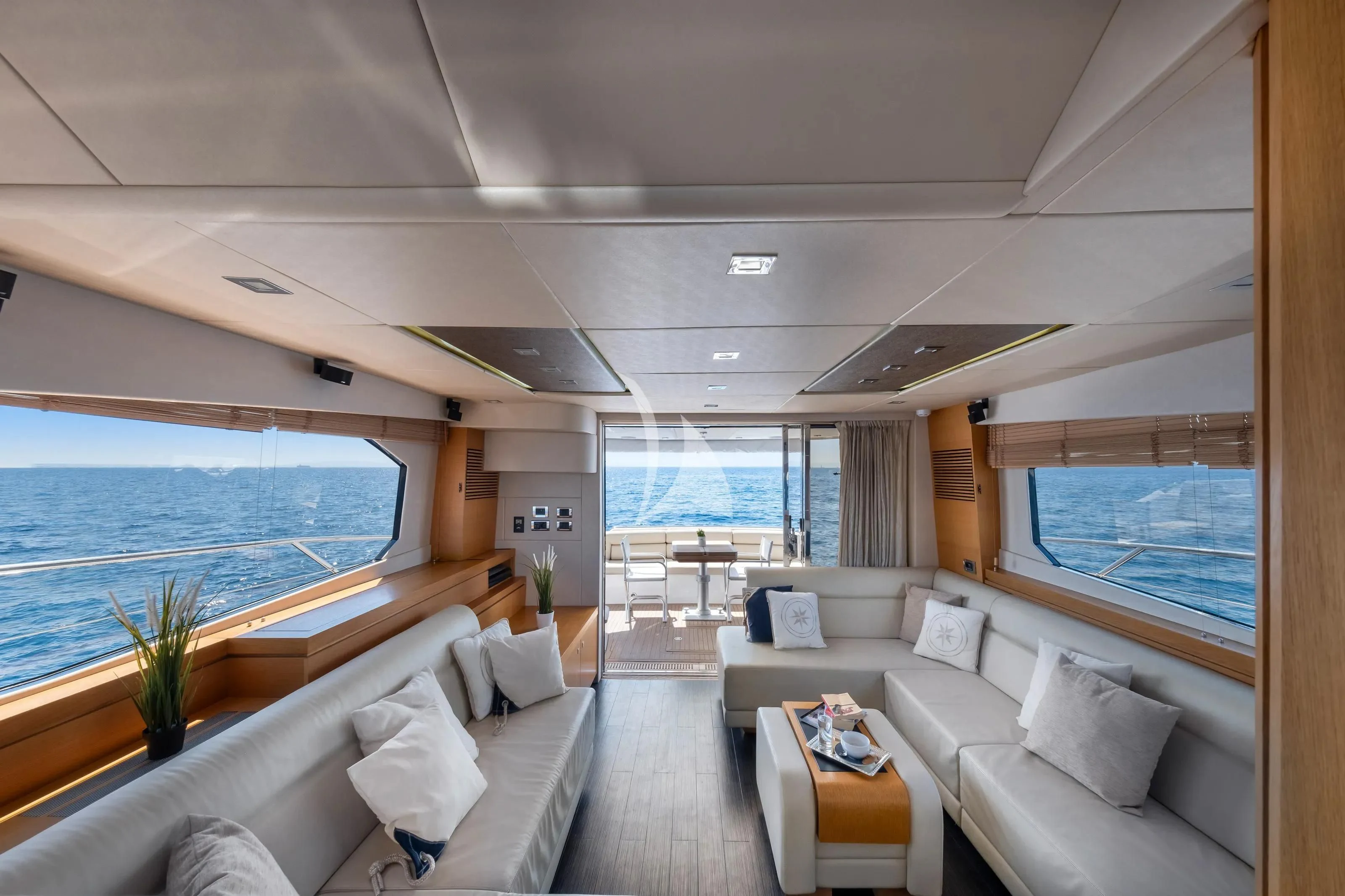 a living room with a large window aboard POLPO Yacht for Charter