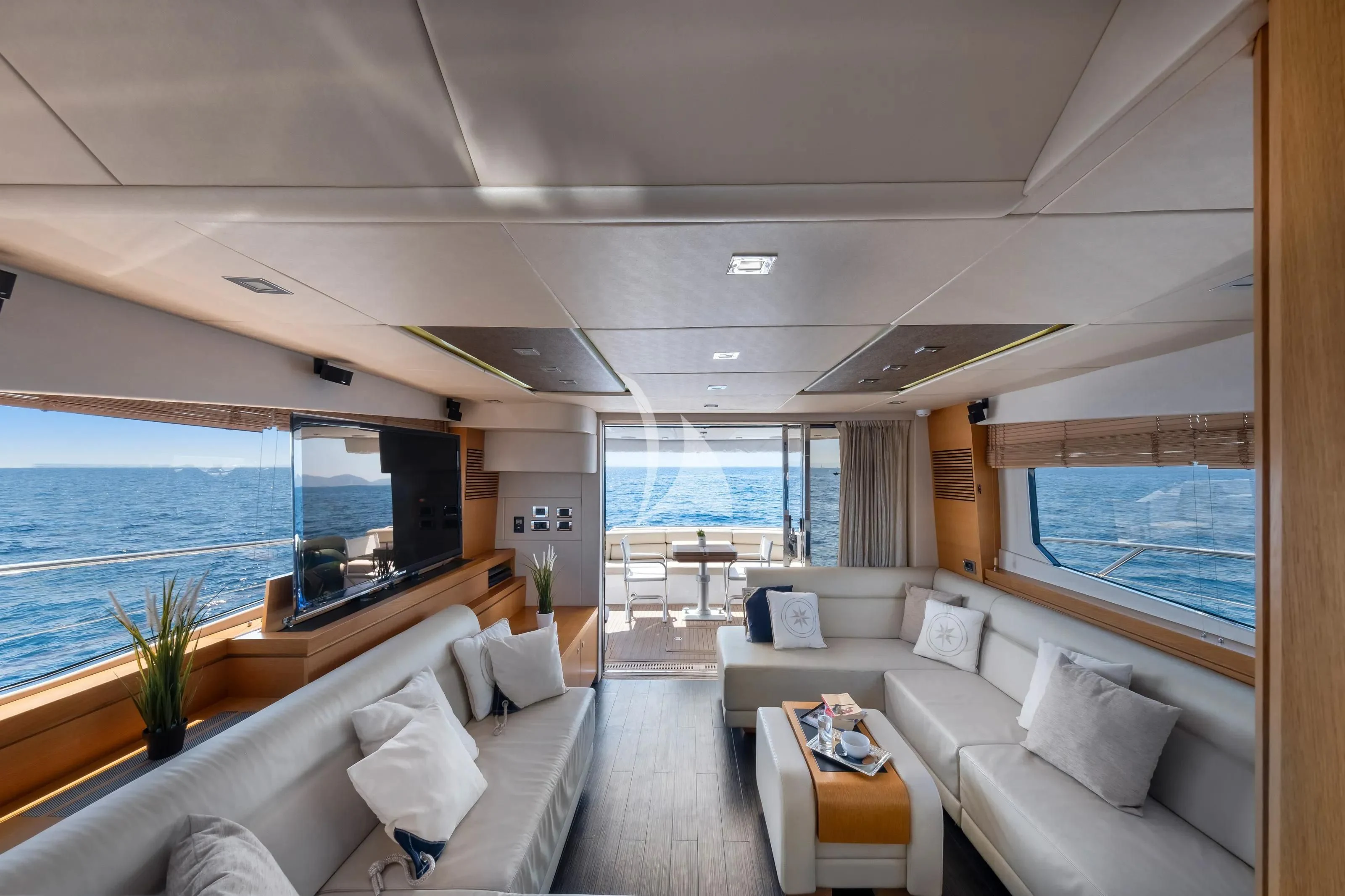 a living room with a large window aboard POLPO Yacht for Charter