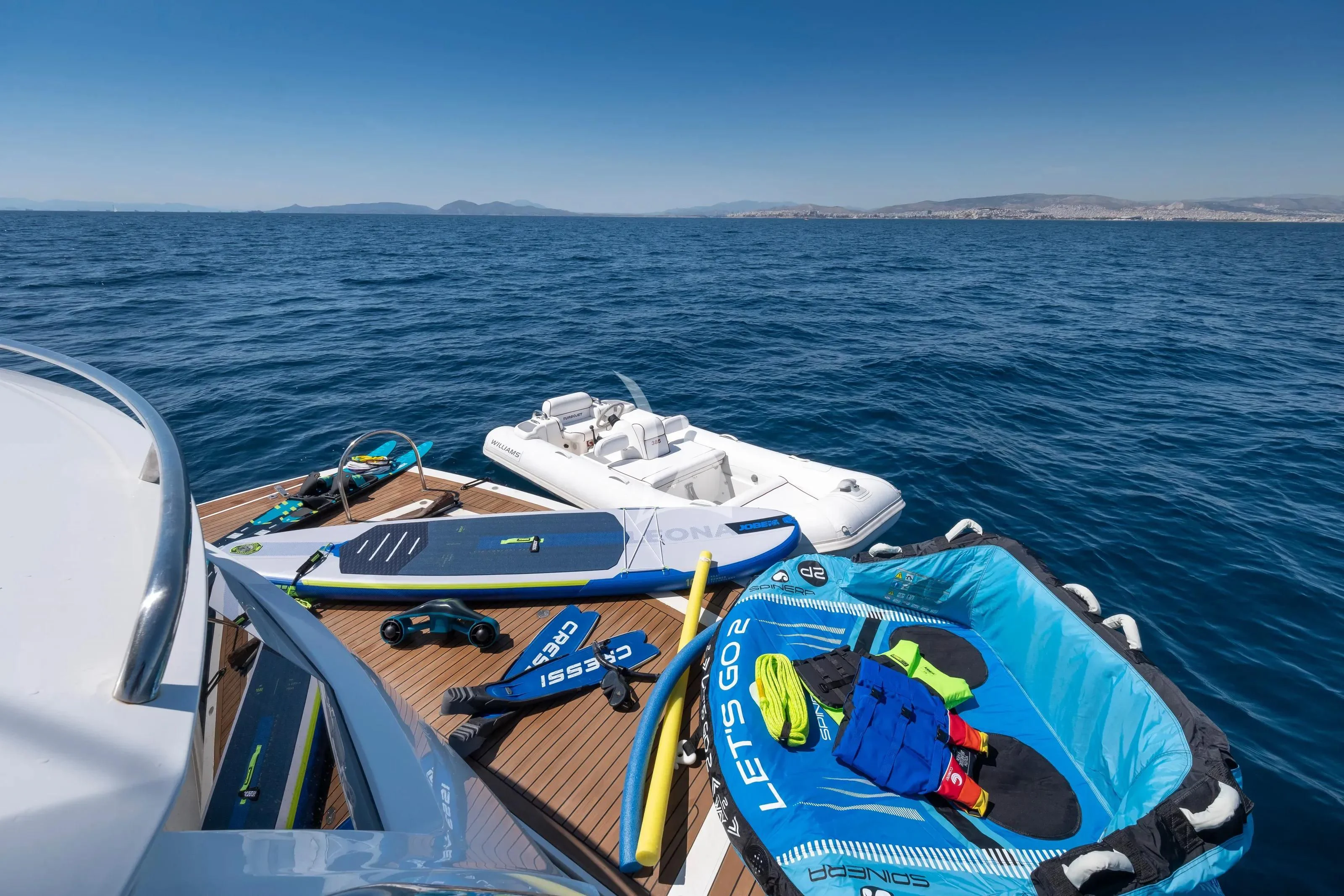 a group of boats on a body of water aboard POLPO Yacht for Charter