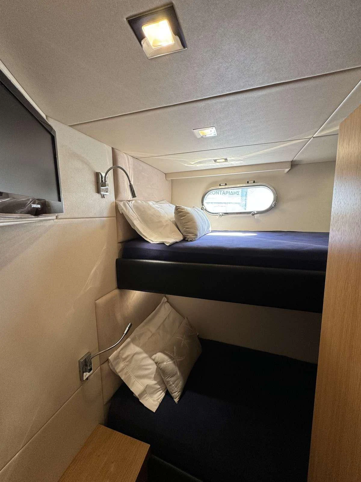 a bed in a room aboard POLPO Yacht for Charter