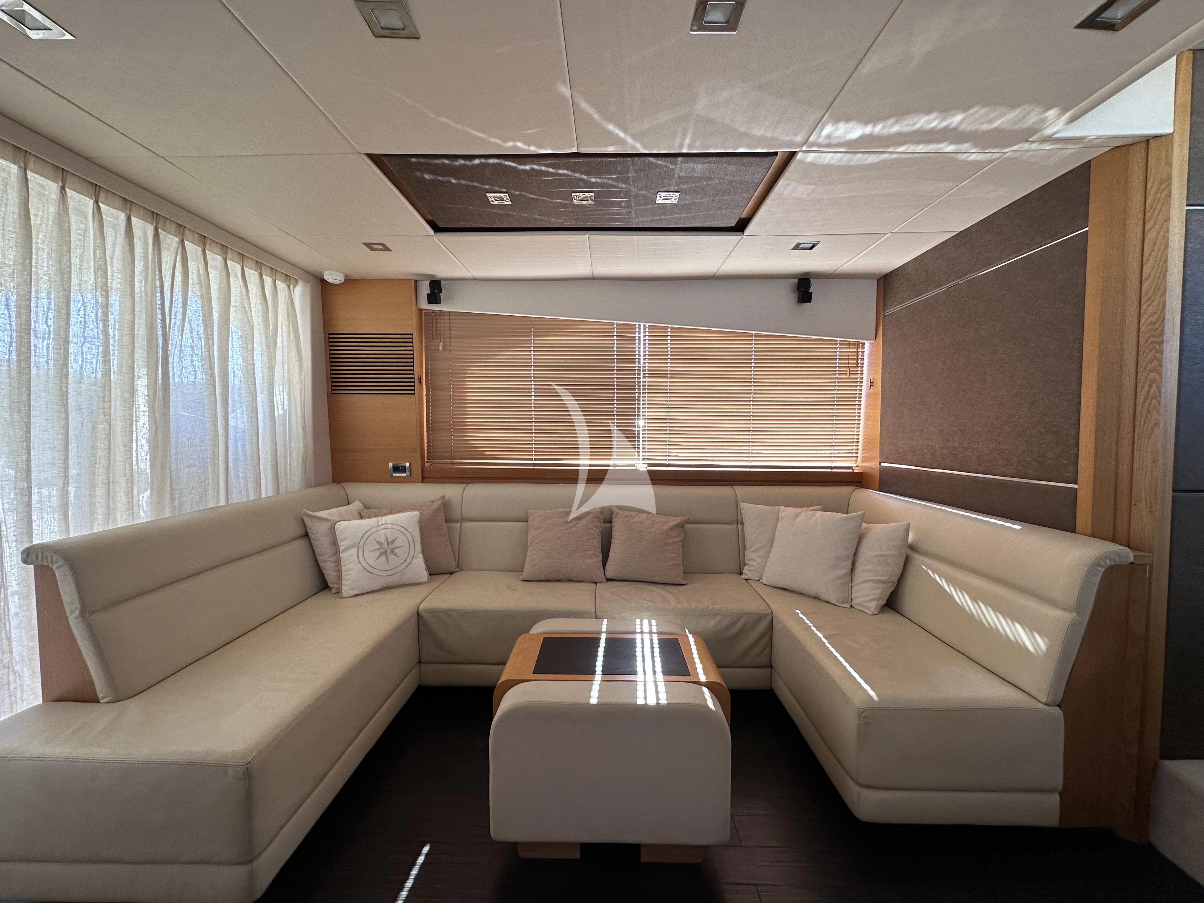 a living room with a couch and a table aboard POLPO Yacht for Charter