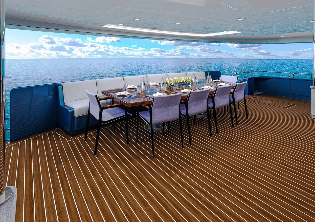 a wood deck with chairs and a table with a view of the ocean aboard STELLARCAT AL2502 Yacht for Sale