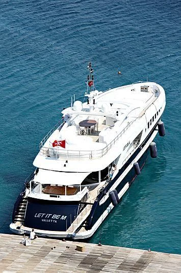 a large ship on the water aboard LET IT BE M Yacht for Sale