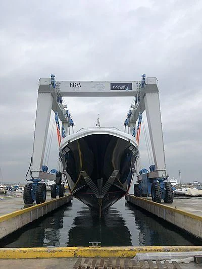 a large white boat with a large wheel on the side aboard LET IT BE M Yacht for Sale