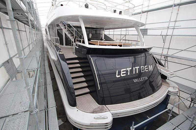 a black boat on a white surface aboard LET IT BE M Yacht for Sale