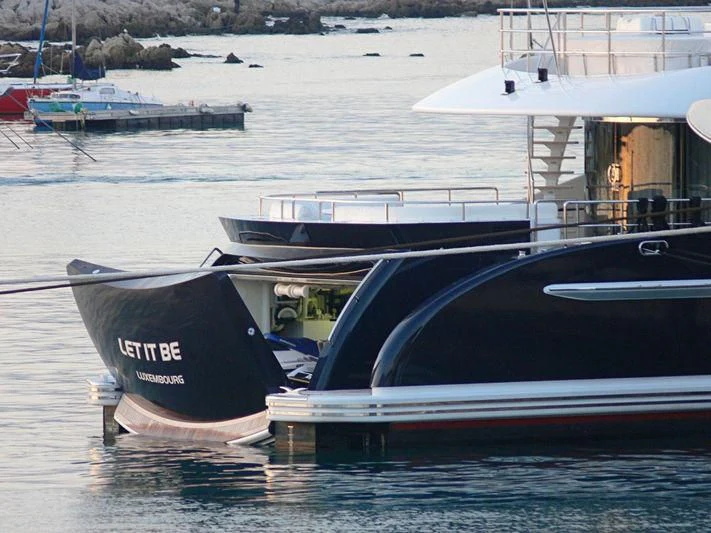 a boat docked at a pier aboard LET IT BE M Yacht for Sale