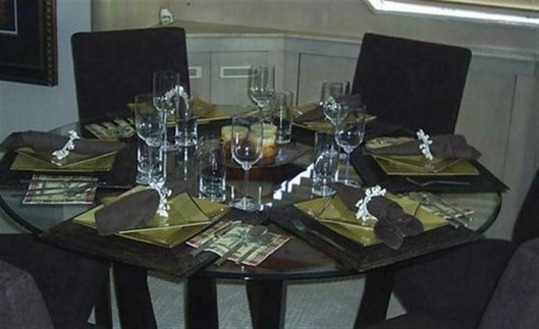 a table with a plate of food and glasses on it aboard THE BEST DAY Yacht for Sale