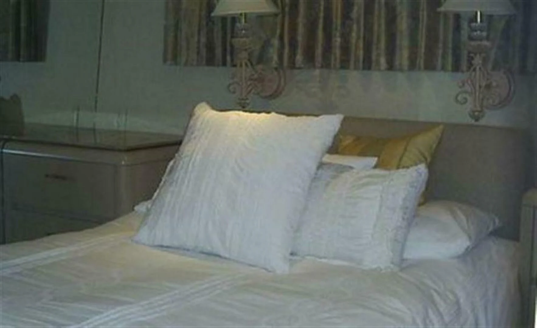 a bed with white pillows aboard THE BEST DAY Yacht for Sale