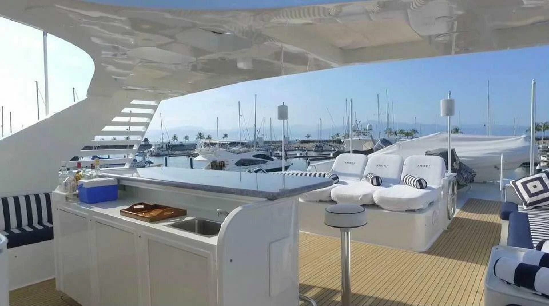 a large room with a large white table and chairs aboard THE BEST DAY Yacht for Sale