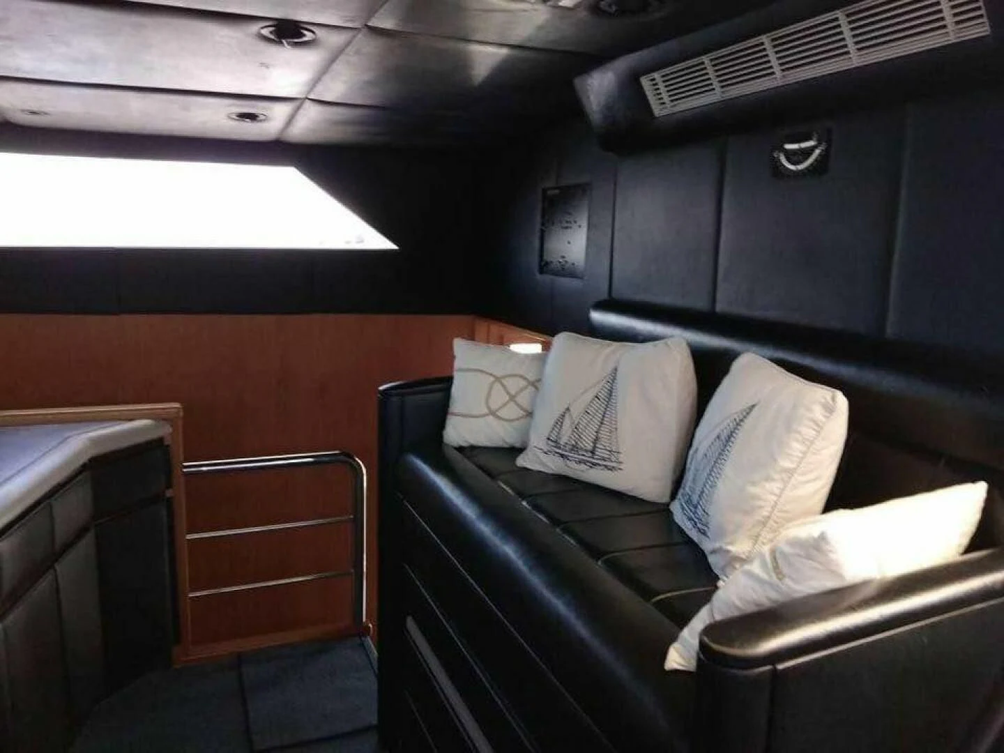 a room with a couch and a guitar aboard THE BEST DAY Yacht for Sale