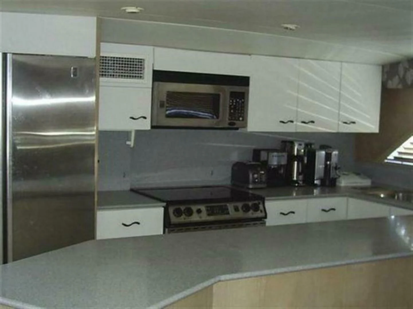 a kitchen with a microwave oven aboard THE BEST DAY Yacht for Sale