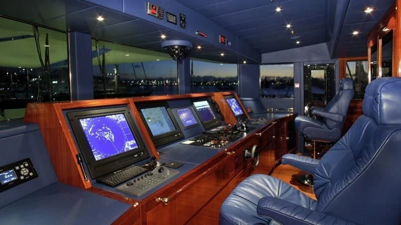 a control room with many monitors aboard EMELINA Yacht for Sale