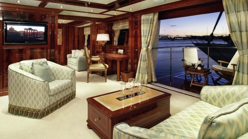 a living room with a large window aboard EMELINA Yacht for Sale
