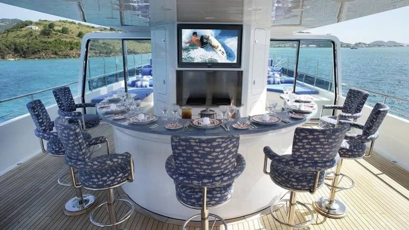 a table with plates and cups on it aboard EMELINA Yacht for Sale