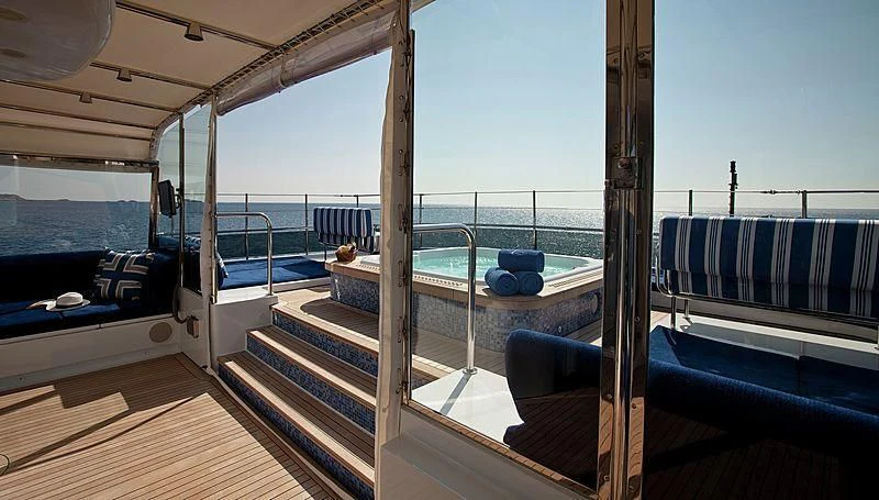 a deck with a view of the ocean and the deck aboard EMELINA Yacht for Sale