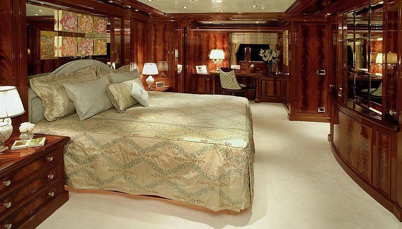 a large bed in a room aboard EMELINA Yacht for Sale