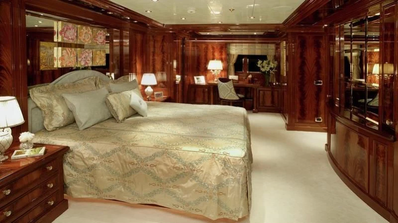 a large bedroom with a large bed aboard EMELINA Yacht for Sale