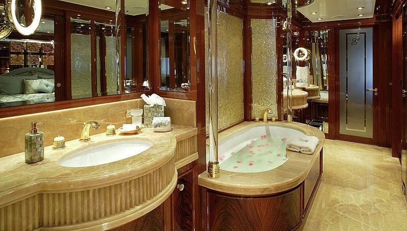 a bathroom with a tub sink and a sink aboard EMELINA Yacht for Sale