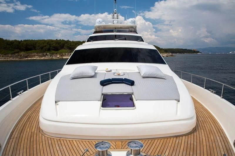 a boat on a water body aboard PORTHOS SANS ABRI Yacht for Sale