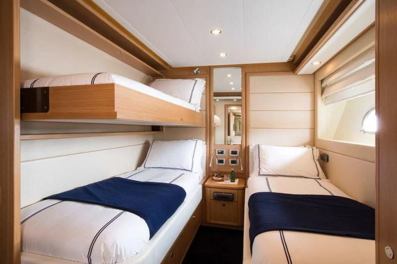 a room with two beds aboard PORTHOS SANS ABRI Yacht for Sale