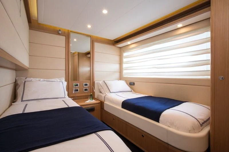 a room with two beds aboard PORTHOS SANS ABRI Yacht for Sale