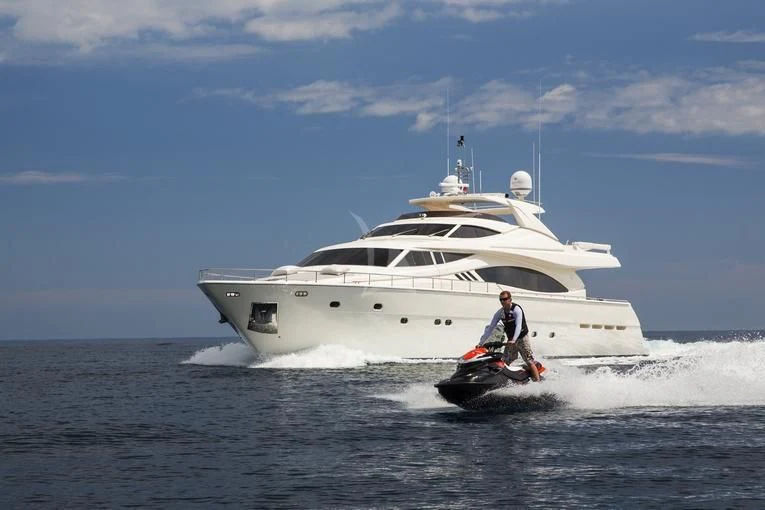 a person on a boat in the water aboard PORTHOS SANS ABRI Yacht for Sale