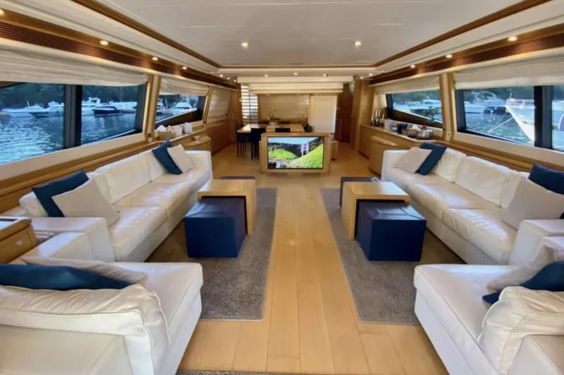 a living room with a large window aboard PORTHOS SANS ABRI Yacht for Sale