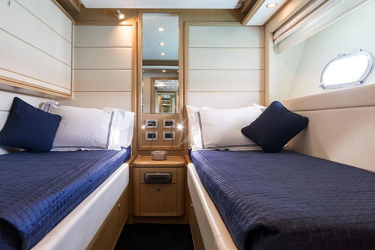 a couple of beds in a room aboard PORTHOS SANS ABRI Yacht for Sale