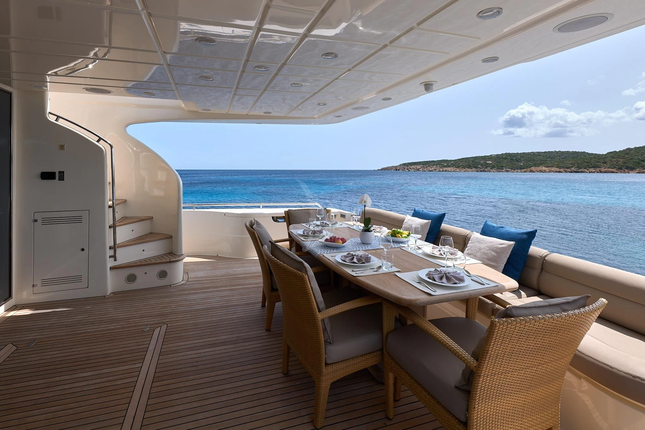 a table set for a meal on a boat aboard PORTHOS SANS ABRI Yacht for Sale