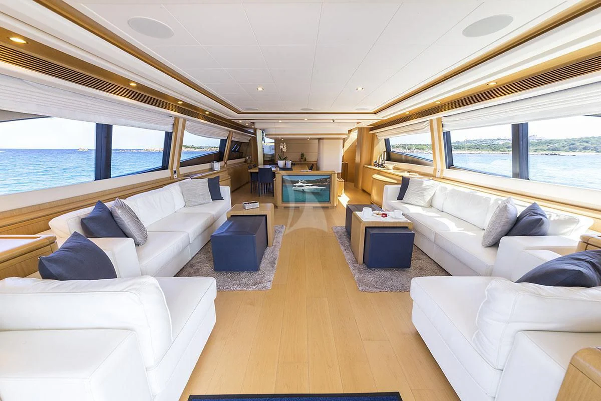 a large living room with a large window aboard PORTHOS SANS ABRI Yacht for Sale