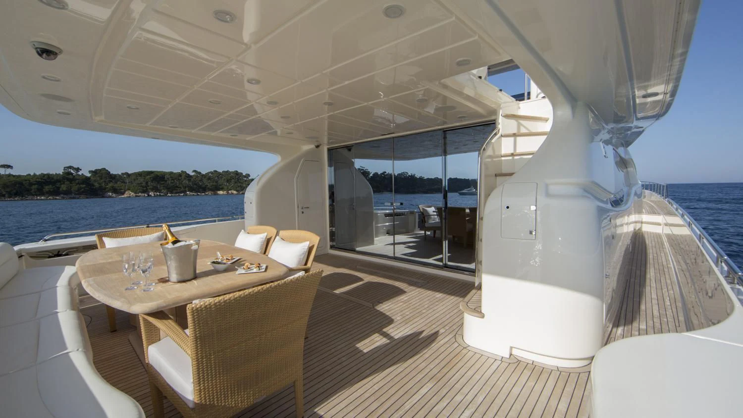 a table and chairs on a boat aboard PORTHOS SANS ABRI Yacht for Sale