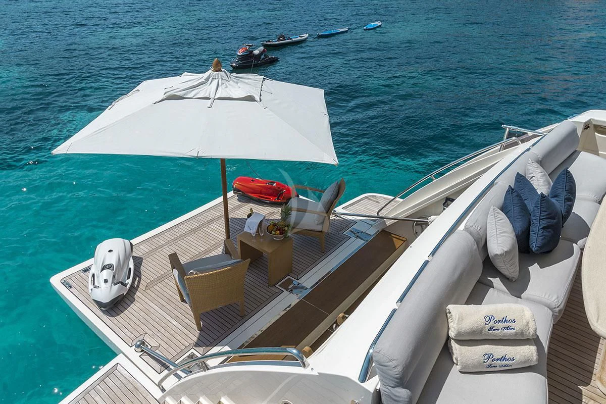 a boat with a white umbrella on it aboard PORTHOS SANS ABRI Yacht for Sale