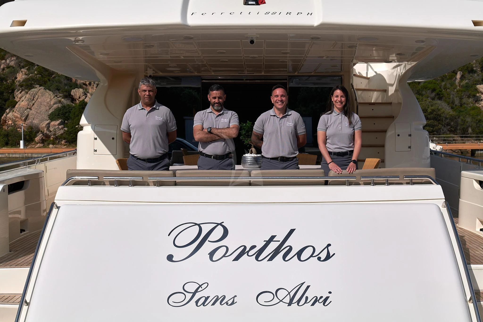 a group of people standing in a building aboard PORTHOS SANS ABRI Yacht for Sale
