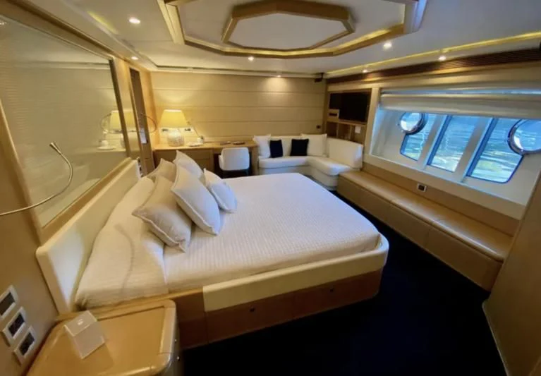 a room with a bed and a window aboard PORTHOS SANS ABRI Yacht for Sale