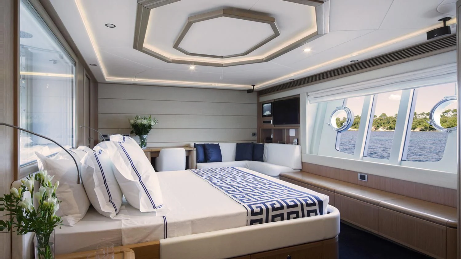 a room with a bed and a window aboard PORTHOS SANS ABRI Yacht for Sale
