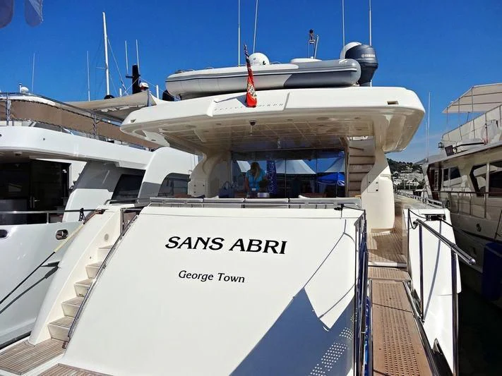 a large white boat with a white sign on it aboard PORTHOS SANS ABRI Yacht for Sale